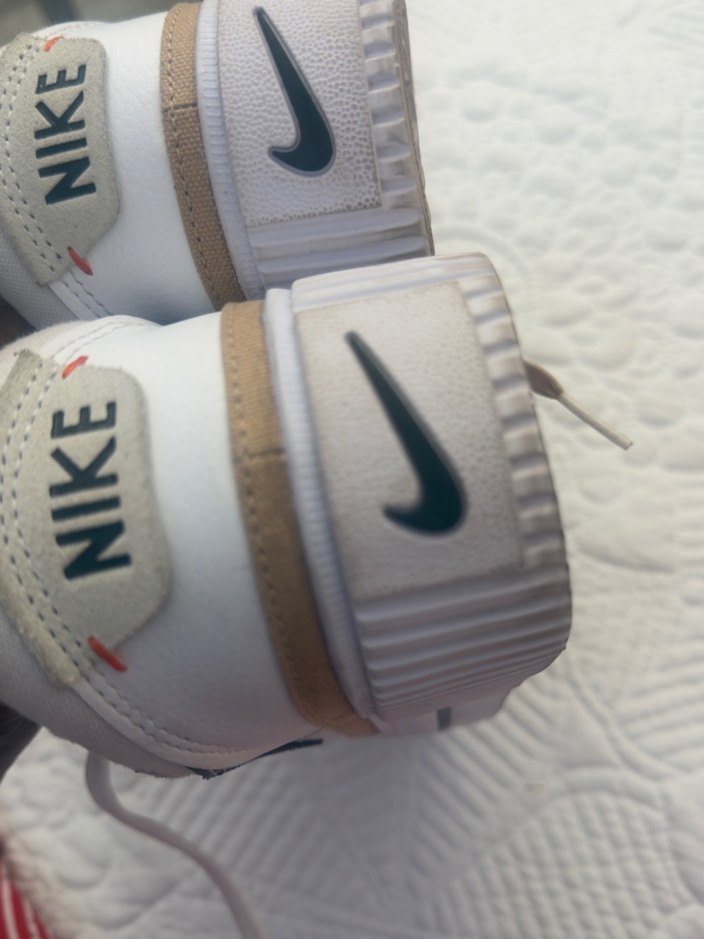 Nike Kids White Sneakers with Tan Accents and Teal Swoosh